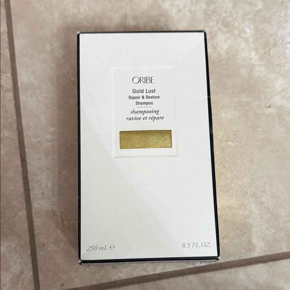 Oribe Gold Lust Shampoo with Black and Gold Accents